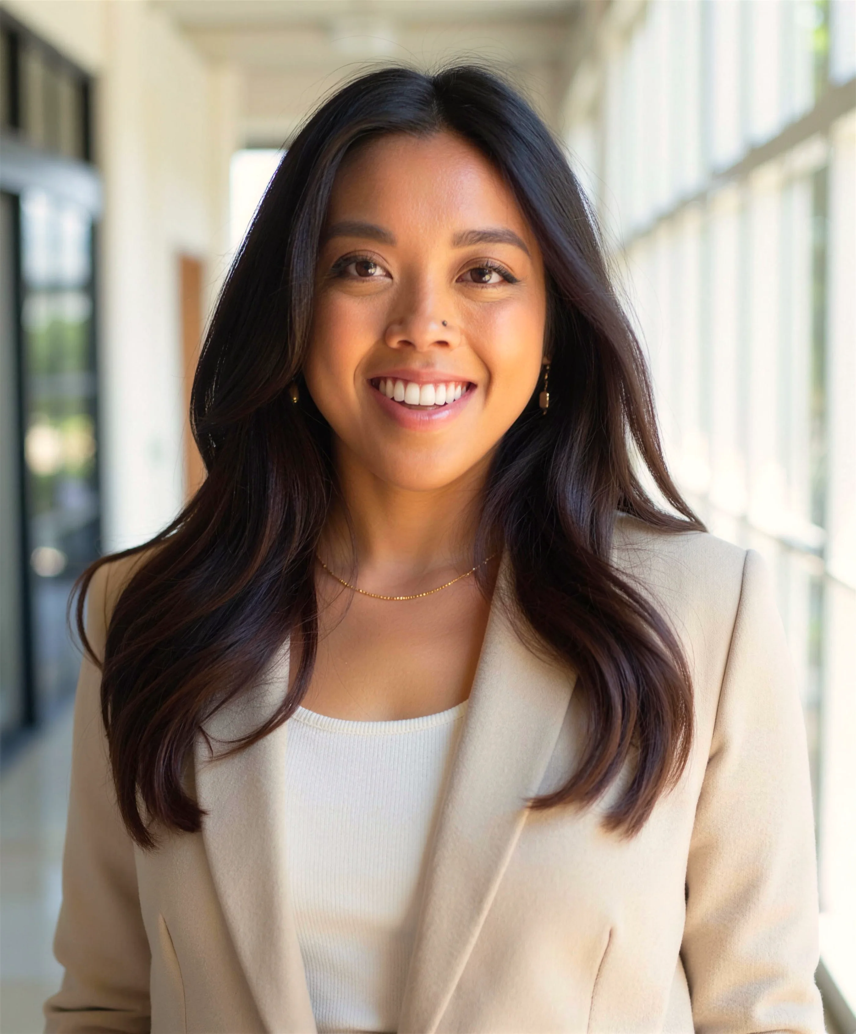 Portrait of Dr. Lexi Gonzales in a cream blazer